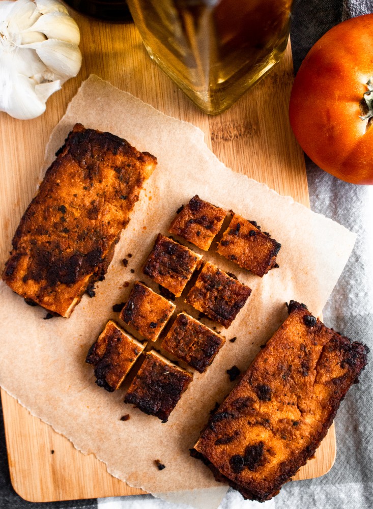 These Balsamic Tomato Tofu Cutlets are crazy meaty, full of balsamic-tomato-garlic-y flavor thanks to a dynamite tofu marinade, and very easy to make! They are meal-prep and freezer-friendly and pair beautifully with pasta, on a sandwich, or straight off the pan. #vegan #tofu #balsamic #plantbased #veganrecipes #tofurecipes // plantpowercouple.com
