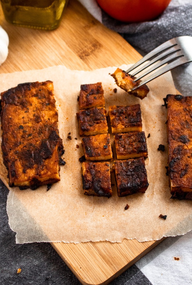 These Balsamic Tomato Tofu Cutlets are crazy meaty, full of balsamic-tomato-garlic-y flavor thanks to a dynamite tofu marinade, and very easy to make! They are meal-prep and freezer-friendly and pair beautifully with pasta, on a sandwich, or straight off the pan. #vegan #tofu #balsamic #plantbased #veganrecipes #tofurecipes // plantpowercouple.com