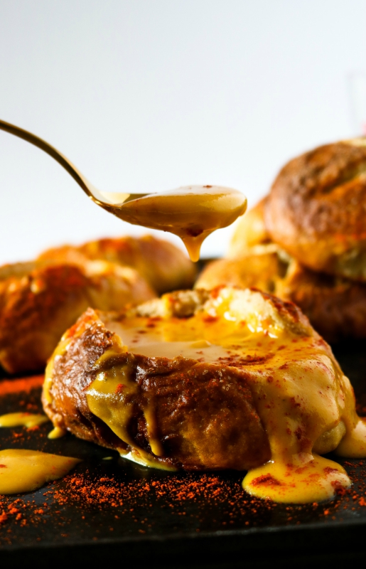 Vegan Beer Cheese Soup in a soft pretzel bowl to make all your Oktoberfest dreams come true! This stuff is so ooey gooey delicious, and you'll be shocked it contains secret veggies too! #vegan // plantpowercouple.com
