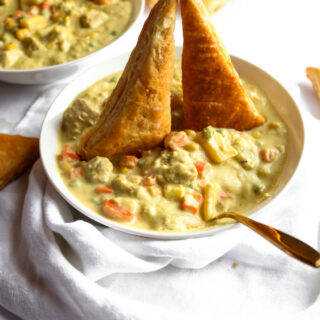 This vegan chicken(less) stew is the PERFECT winter comfort food! It's warm and soul-healing but also FULL of surprise veggies and flavor. It's also freezer-friendly and has a gluten-free option. #vegan #stew #veganrecipes #cauliflower #comfortfood // plantpowercouple.com