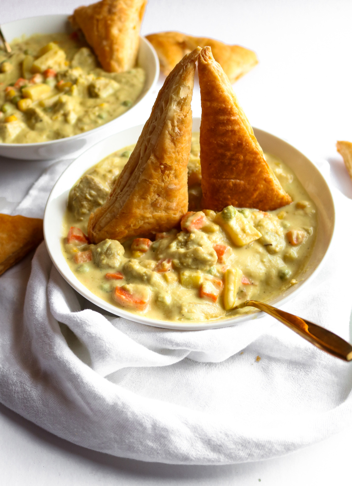 This vegan chicken(less) stew is the PERFECT winter comfort food! It's warm and soul-healing but also FULL of surprise veggies and flavor. It's also freezer-friendly and has a gluten-free option. #vegan #stew #veganrecipes #cauliflower #comfortfood // plantpowercouple.com