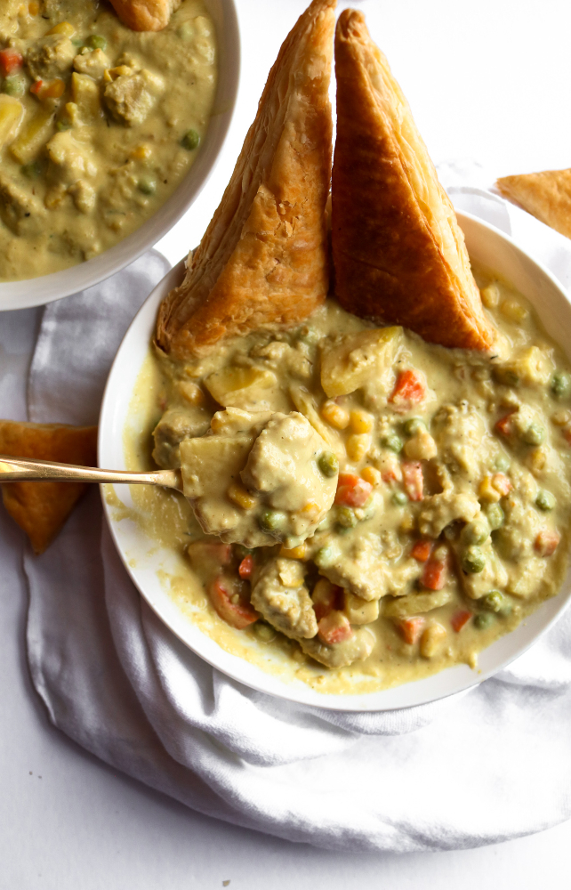 This vegan chicken(less) stew is the PERFECT winter comfort food! It's warm and soul-healing but also FULL of surprise veggies and flavor. It's also freezer-friendly and has a gluten-free option. #vegan #stew #veganrecipes #cauliflower #comfortfood // plantpowercouple.com