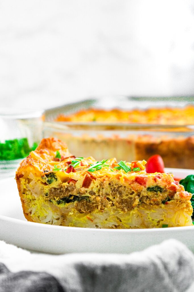 Head on photo of a slice of vegan just egg casserole on a plate