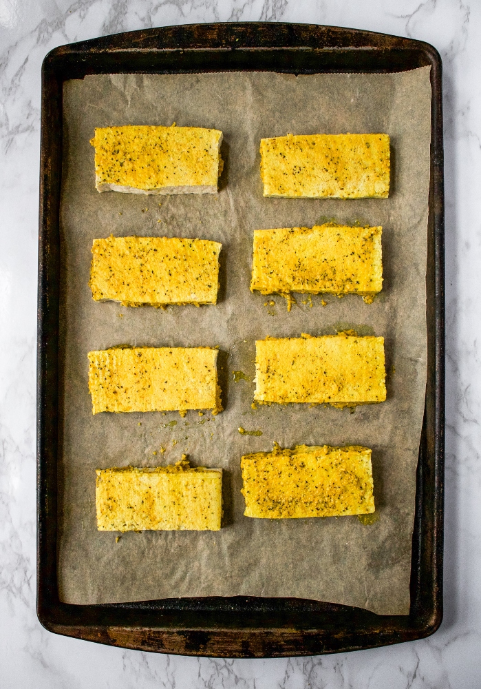 These Lemon Pepper Tofu Cutlets are the perfect meal prep staple! Frozen + thawed tofu is sliced and soaked in a bath of zesty lemon pepper flavor. Then, they’re slow-baked to achieve that perfect meaty texture. Slice ‘em up for salads, use them for sandwiches, or serve ‘em over a mountain of rice for a filling and easy vegan dinner!