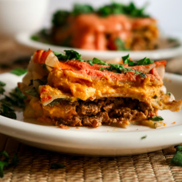 This Vegan Tikka Masala Lasagna is pure comfort food! All the things you love about traditional lasagna but with an Indian-inspired flavor that will knock you off your feet! Easy to make and freezer friendly too! // plantpowercouple.com