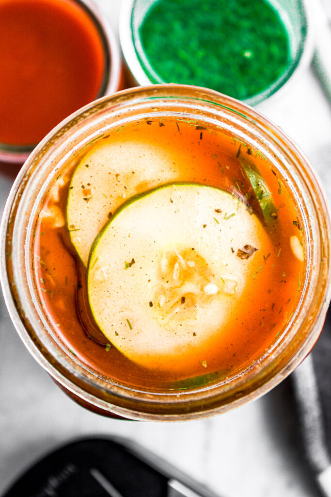 Overhead close up view of pickles in buffalo ranch pickle brine