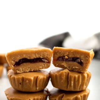 PB + J meets peanut butter cup in this killer combo of classic comfort foods! These delightful PB+J Cups are easy to make with only 4 ingredients, simple methods, and no heat required. They’re the ultimate summer sweet for your kids or the kid in us all! #vegan #dairyfree #vegancandy #veganrecipes #glutenfree //plantpowercouple.com