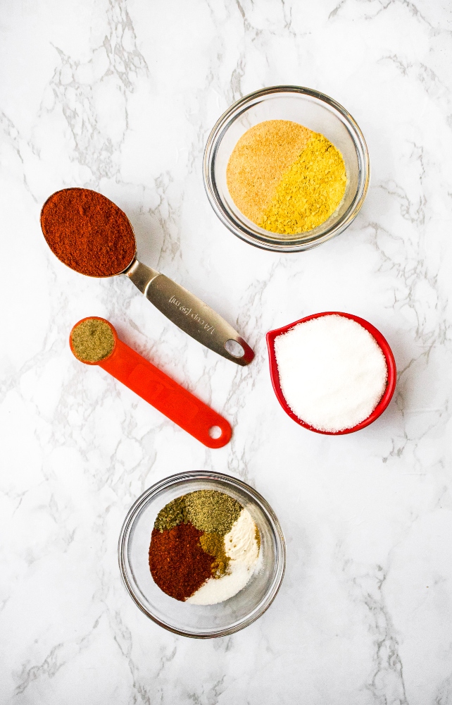 Copycat Red Robin Seasoning: paprika, sea salt, celery salt, nutritional yeast, chili powder, black pepper, dried basil, onion powder, ground cumin.