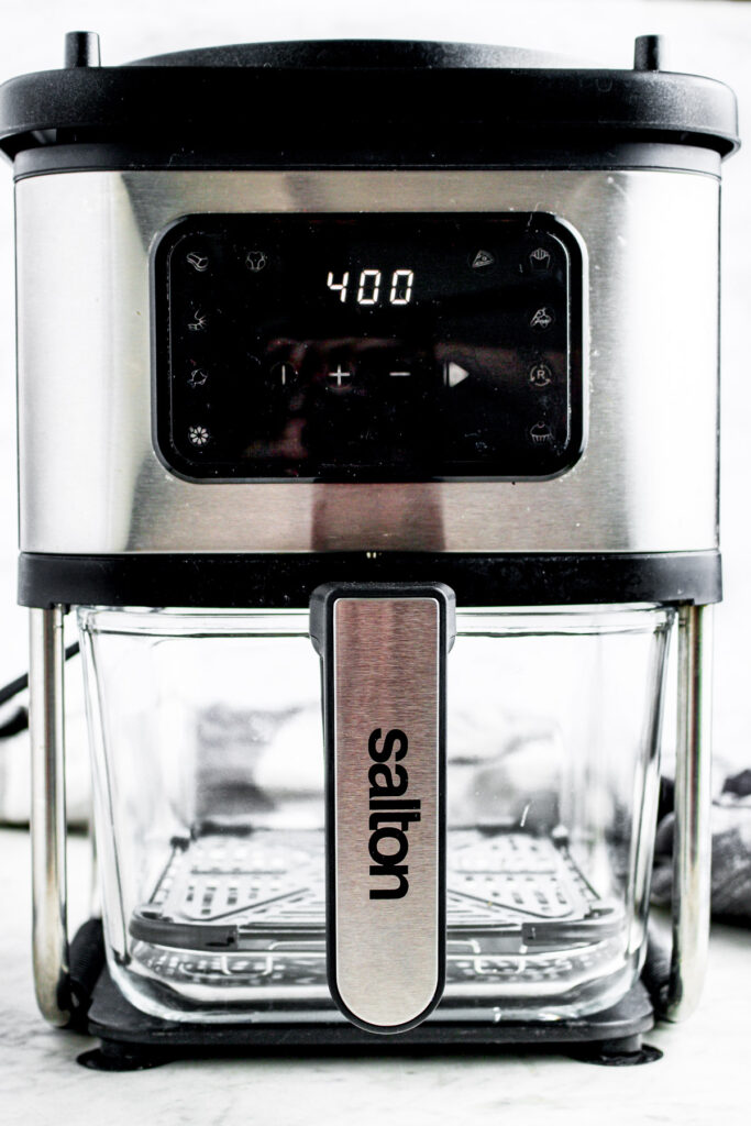 Head on photo of a Salton 3-in-1 Flip and Cook with glass jar