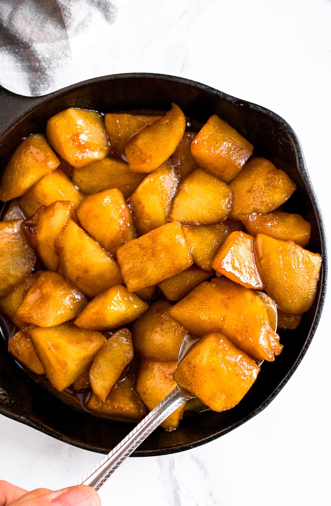 These vegan sauteed cinnamon apples are made on the stovetop and the best topping for pancakes, waffles, or ice cream. These dairy-free sauteed apples are gluten-free, include a low-sugar option, and taste like warm apple pie filling with just 5 simple ingredients. Our favorite way to use up excess apples!