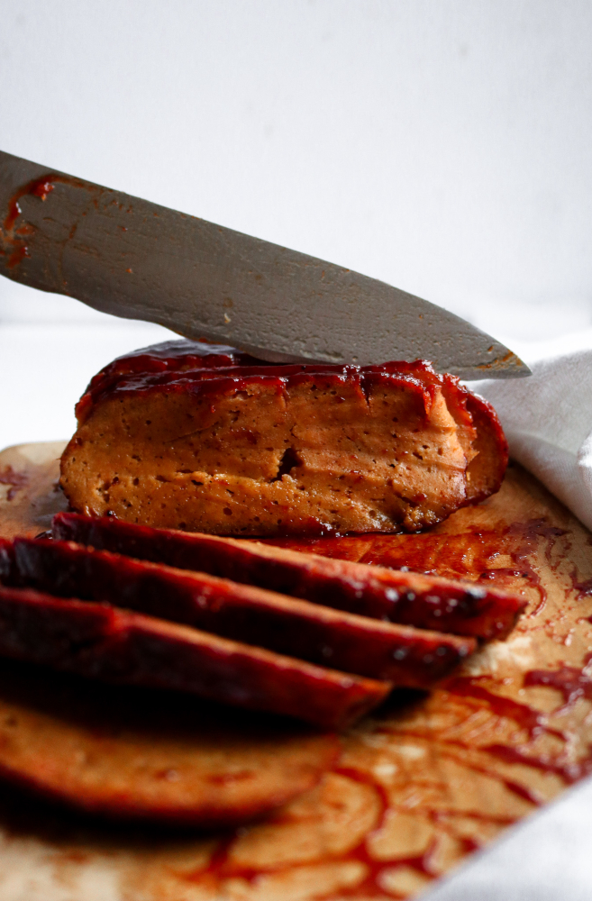Make this vegan seitan ham when you really want to impress! It's full of smoky-sweet flavor and glazed with a pineapple mustard sauce that blow your mind. Beet puree is added for extra color and WOW factor. #seitan #vegan #vegetarian // plantpowercouple.com