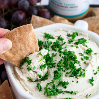 This vegan tahini feta dip is quick, uncomplicated, mind-blowingly flavorful, and the perfect spring appetizer. All you need is a food processor, 10 minutes, and 11 simple ingredients.﻿ #vegan #plantbased #appetizer #dip #tofu // plantpowercouple.com