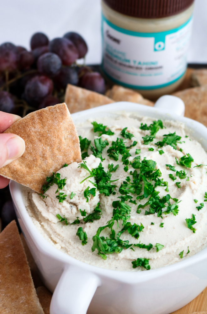This vegan tahini feta dip is quick, uncomplicated, mind-blowingly flavorful, and the perfect spring appetizer. All you need is a food processor, 10 minutes, and 11 simple ingredients.﻿ #vegan #plantbased #appetizer #dip #tofu // plantpowercouple.com