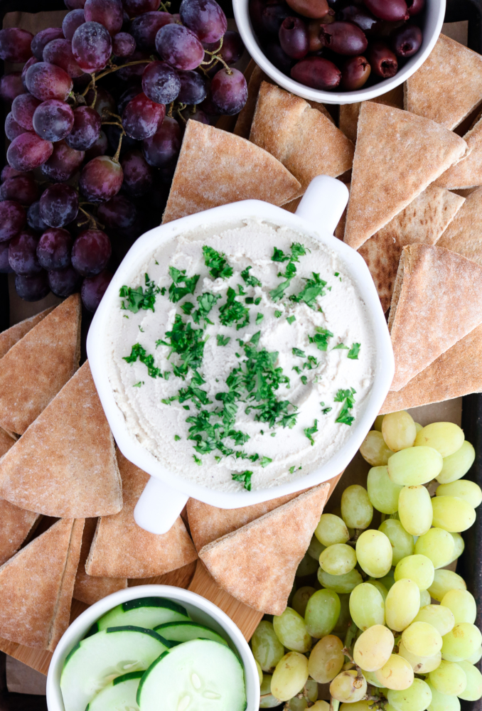 This vegan tahini feta dip is quick, uncomplicated, mind-blowingly flavorful, and the perfect spring appetizer. All you need is a food processor, 10 minutes, and 11 simple ingredients.﻿ #vegan #plantbased #appetizer #dip #tofu // plantpowercouple.com