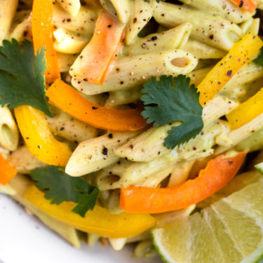 Vegan Tequila Lime Pasta recipe is going to be your favorite summer dinner! It’s easy to make, healthy, and FULL of fun summer flavor. Serve it cold as a side at all your outdoor BBQs or hot as a main dish with some grilled summer veg. #vegan #dinner #pasta #glutenfree // plantpowercouple.com