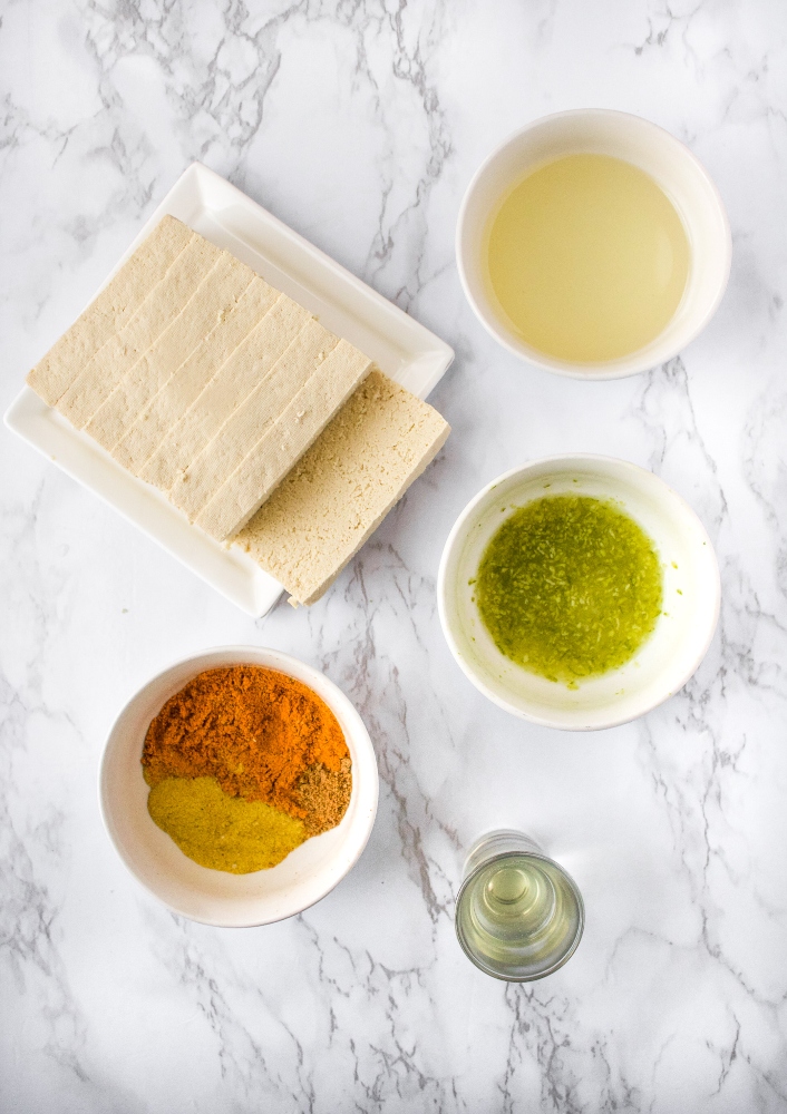 These Tequila Lime Tofu Cutlets are perfect for tofu tacos, quesadillas, or Mexican-inspired dinner bowls and salads! They are easy to make with a quick tequila-infused chili lime marinade, and slow-baked until they are crispy on the outside and meaty on the inside! You’ll love to add this tofu recipe for your weekly meal prep. Oh and they are freezer-friendly too!