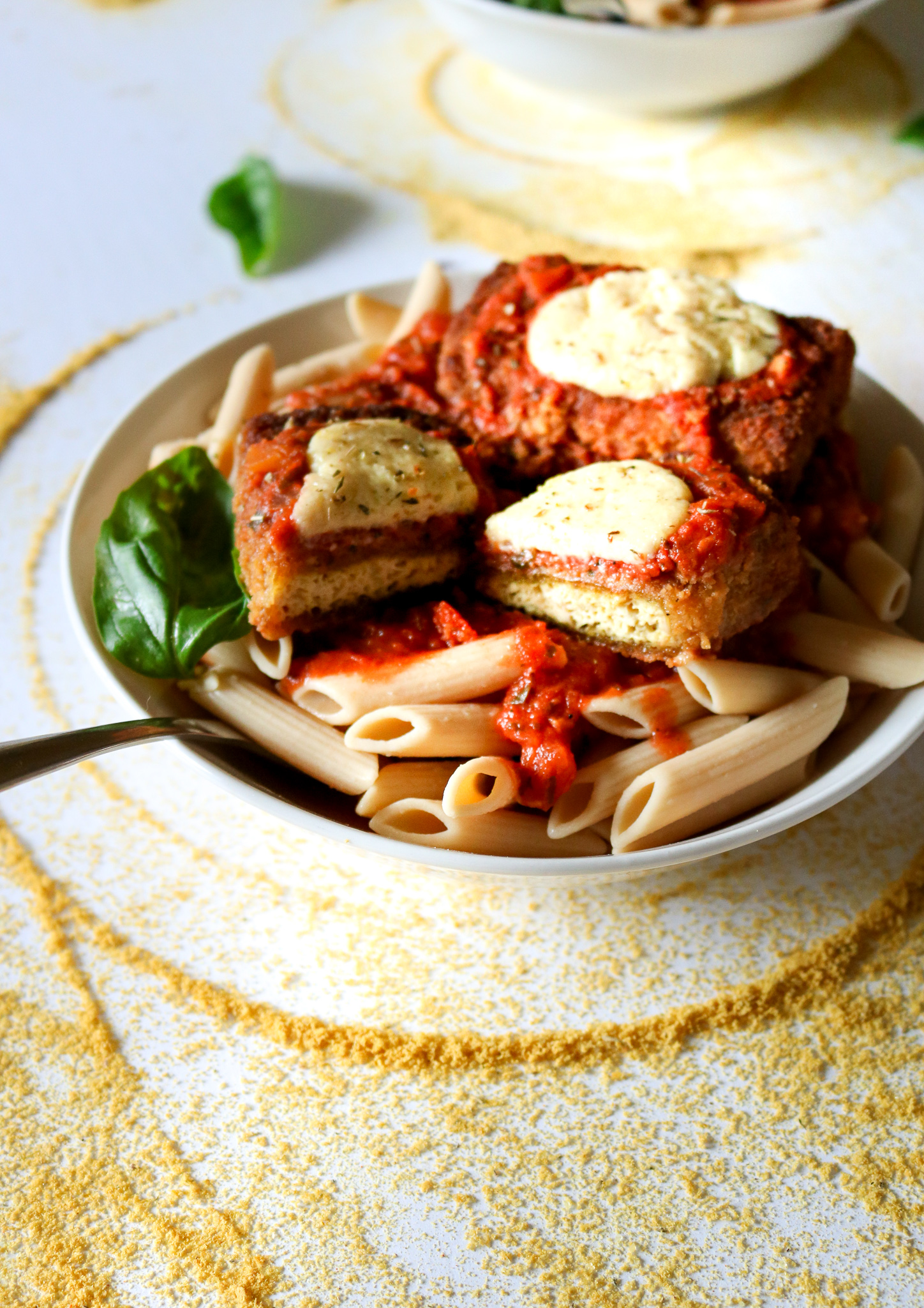 The BEST vegan chicken parmesan we've ever tasted! You won't believe these cutlets are made with tofu after you're done with them, and that peppery breading really knocks it outta the park. Gluten-free option, and the cutlets are freezer-friendly! // plantpowercouple.com
