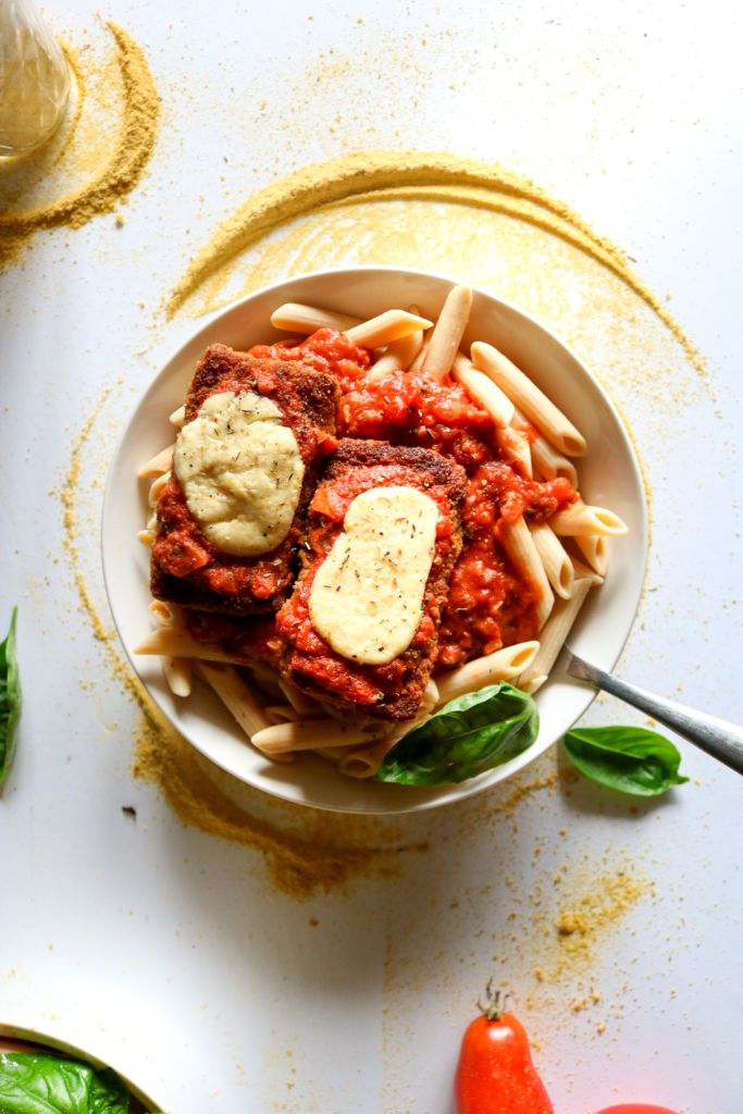The BEST vegan chicken parmesan we've ever tasted! You won't believe these cutlets are made with tofu after you're done with them, and that peppery breading really knocks it outta the park. Gluten-free option, and the cutlets are freezer-friendly! // plantpowercouple.com