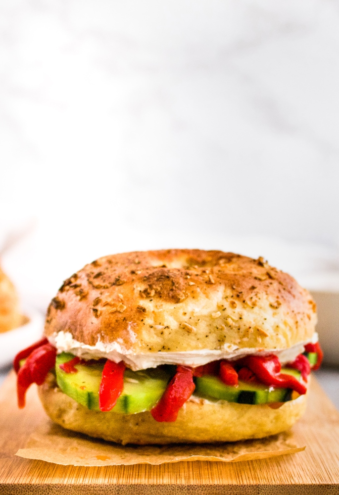 This homemade vegan onion bagel recipe is just as delicious as it is fun to make! Peppery onion plant-based bagels are fantastic served as a vegan bagel sandwich for breakfast with tofu scramble or lunch with dairy-free cream cheese and all the fresh vegetables. In this post, we’ll walk you through how to make your own egg-free bagels at home with step by step photos and instructions!