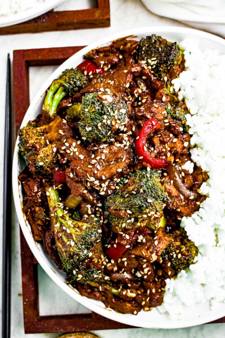 Close up overhead photo of a plate of soy curl beef and broccoli with white rice