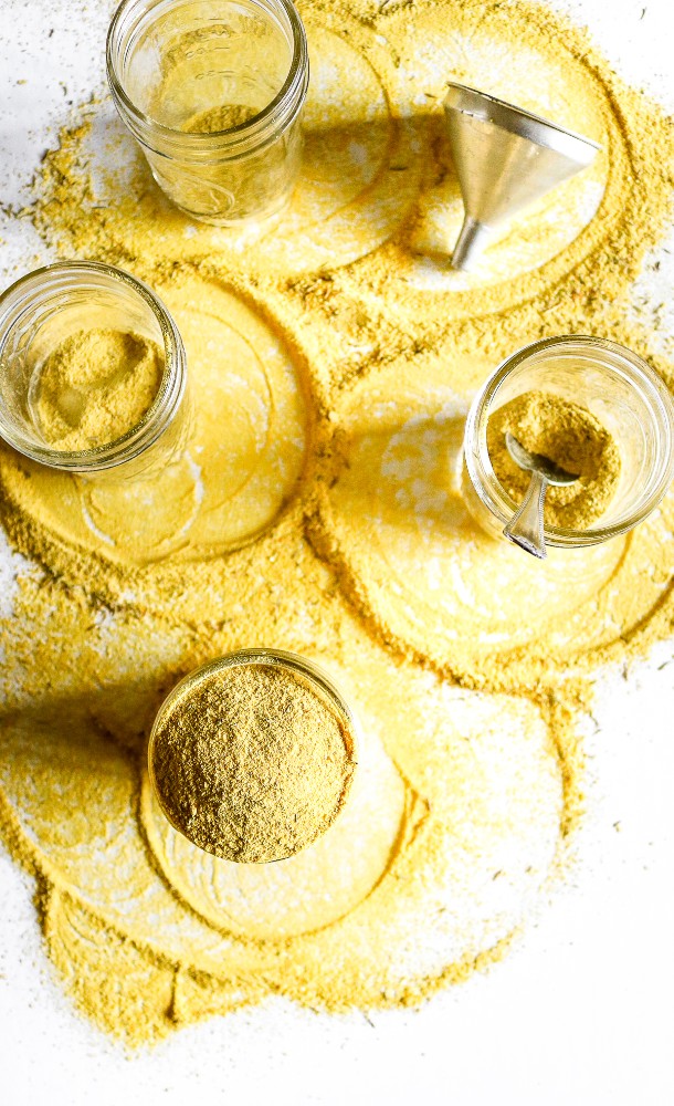 Make your own vegan chicken-style bouillon powder with 7 ingredients, 1 food processor, and less than 10 minutes. Use it to make THE most flavorful chicken-free broth for soups, stews, seitan + tofu marinades, etc. #vegan #veganchicken #veganrecipe #easyveganrecipe #nutritionalyeast #turmeric #plantbased #plantpowercouple // plantpowercouple.com