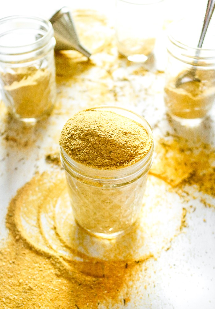 Make your own vegan chicken-style bouillon powder with 7 ingredients, 1 food processor, and less than 10 minutes. Use it to make THE most flavorful chicken-free broth for soups, stews, seitan + tofu marinades, etc. #vegan #veganchicken #veganrecipe #easyveganrecipe #nutritionalyeast #turmeric #plantbased #plantpowercouple // plantpowercouple.com