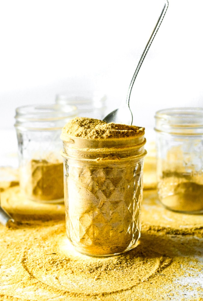 Make your own vegan chicken-style bouillon powder with 7 ingredients, 1 food processor, and less than 10 minutes. Use it to make THE most flavorful chicken-free broth for soups, stews, seitan + tofu marinades, etc. #vegan #veganchicken #veganrecipe #easyveganrecipe #nutritionalyeast #turmeric #plantbased #plantpowercouple // plantpowercouple.com