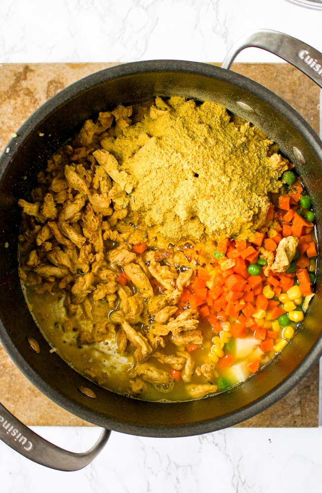 This vegan chicken stew makes the perfect cozy winter dinner. This creamy vegetable stew with meaty soy curls is easy to make using common ingredients, methods, and hidden vegetables like cauliflower! This vegan stew recipe is freezer-friendly and the perfect plant-based meal prep recipe. It’s also gluten-free, dairy-free, and easily made oil-free.