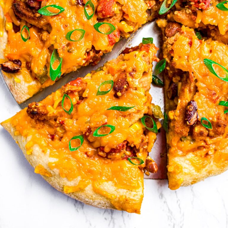 Overhead view of a slice of vegan chili cheese pizza