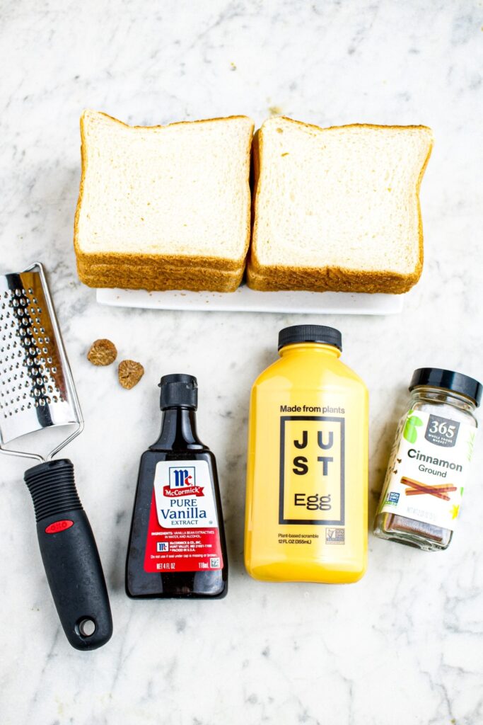 Overhead photo of all the ingredients you need to make just egg french toast
