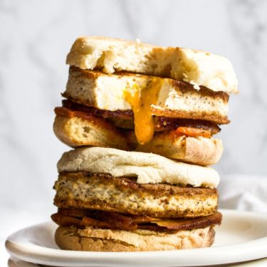 This vegan fried egg is such a fun and delicious recipe. It has a goopy vegan yolk sauce that drips out of the egg when you bite into it - just perfect for toast dipping or a messy fried egg breakfast sandwich. #tofu #veganegg #veganeggyolk #veganfriedegg #veganbreakfast #veganbreakfastsandwich #tofuegg #tofufriedegg #veganbrunch #comfortfood