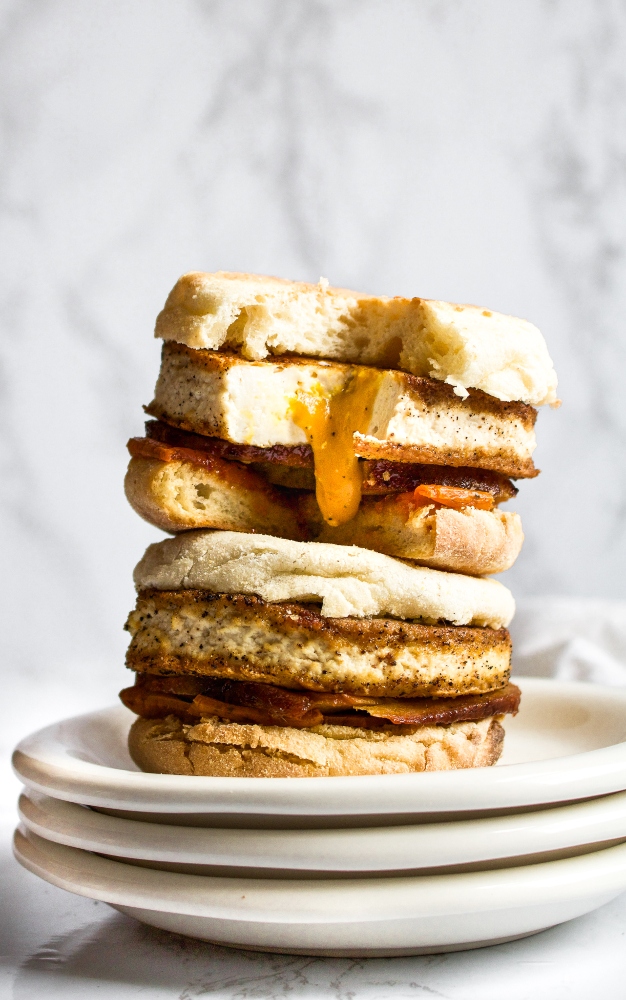 This vegan fried egg is such a fun and delicious recipe. It has a goopy vegan yolk sauce that drips out of the egg when you bite into it - just perfect for toast dipping or a messy fried egg breakfast sandwich. #tofu #veganegg #veganeggyolk #veganfriedegg #veganbreakfast #veganbreakfastsandwich #tofuegg #tofufriedegg #veganbrunch #comfortfood