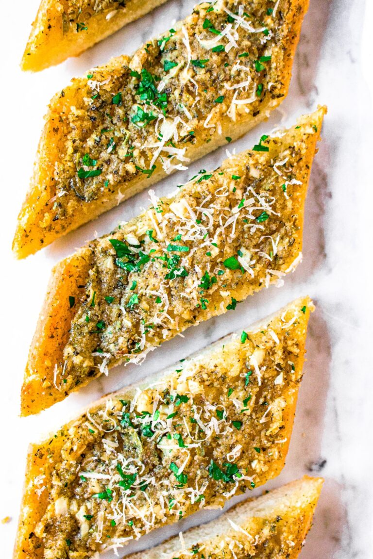 Overhead zoomed in photo of a row of plant-based garlic herb bread