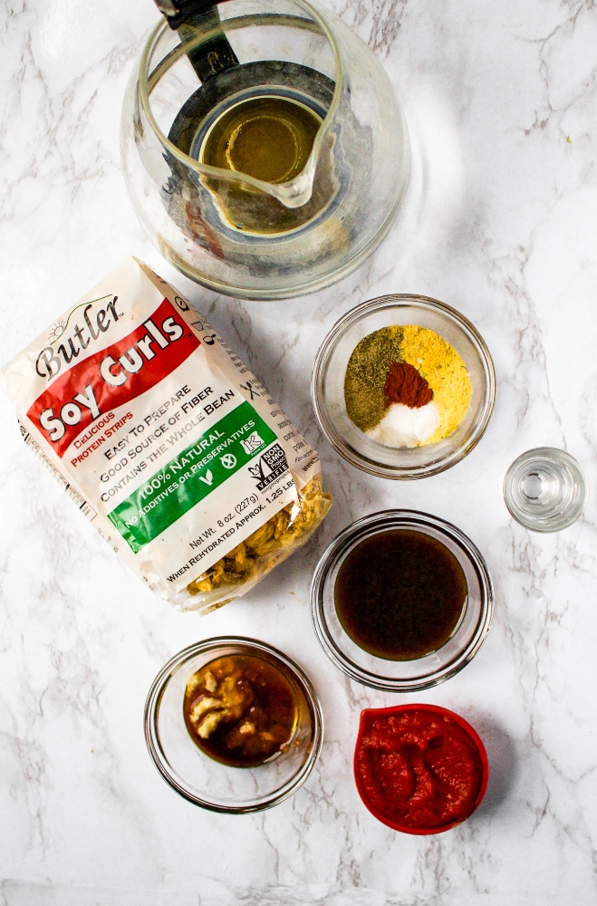 This meaty vegan jerky recipe is made in the air fryer and full of that classic Bloody Mary cocktail flavor. Vegetarian soy curl jerky is the perfect game day snack and pairs beautifully with a cold beer or as part of a Bloody Mary brunch bar! The recipe makes a big batch - perfect for plant-based travel snacking!