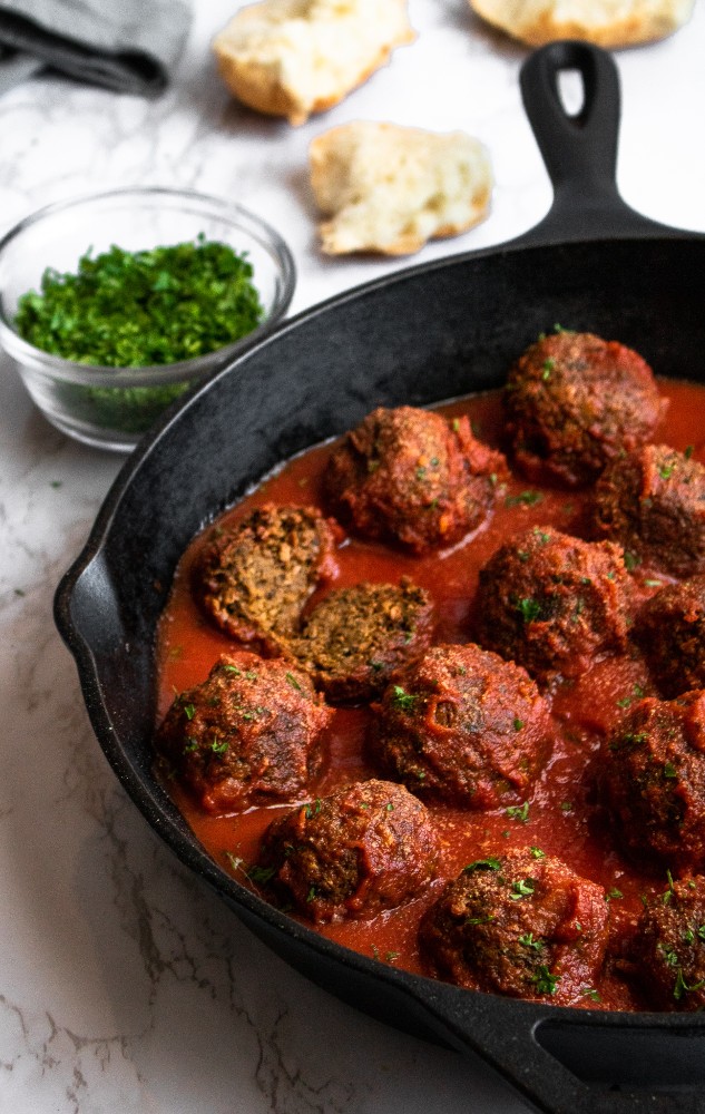 The BEST Vegan Meatballs made with TVP. They're SUPER meaty, full of spicy Italian flavor, and NOT mushy - our #vegan #meatball dreams come true! #vegetarian #veganmeatballs #plantbased #plantpowercouple // plantpowercouple.com