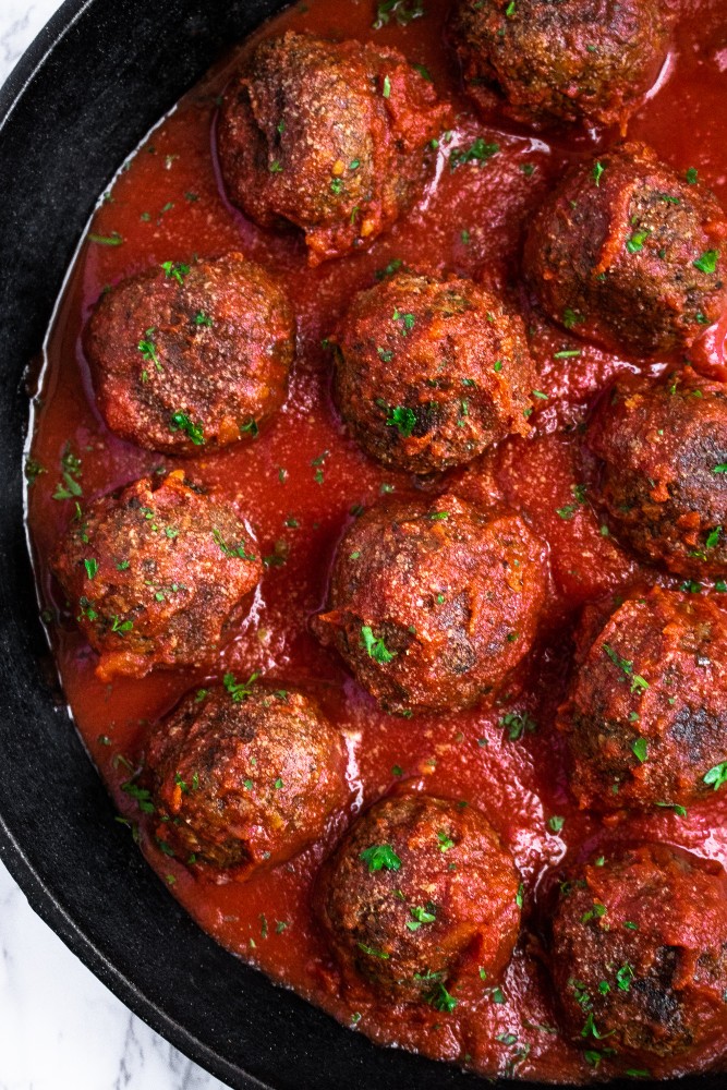 The BEST Vegan Meatballs made with TVP. They're SUPER meaty, full of spicy Italian flavor, and NOT mushy - our #vegan #meatball dreams come true! #vegetarian #veganmeatballs #plantbased #plantpowercouple // plantpowercouple.com