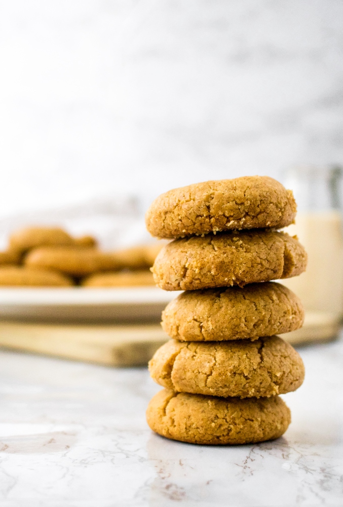 These vegan peanut butter cookies are made dairy-free and egg-free simply by using a flax egg! The decadent vegan cookies are beautifully crumbly and will legit melt in your mouth. They are easy to make - the perfect vegan peanut butter recipe for the holidays or any time of year!