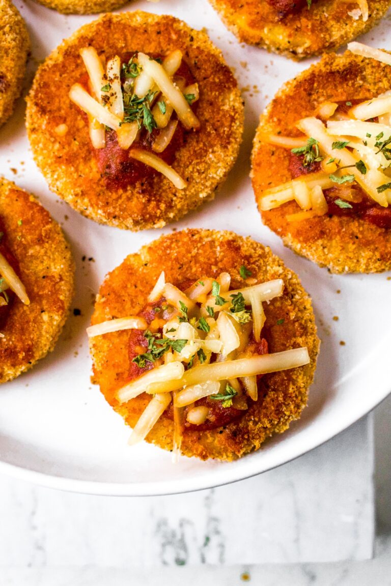 These Polenta Pizza Bites are a delicious and easy appetizer or snack for a potluck or holiday gathering. They are everything you love about pizza but with a crispy polenta crust. The recipe is plant based, dairy free, egg free, and include a simple gluten free option as well. These easy mini pizzas are the perfect vegan party food for kids and adults alike!