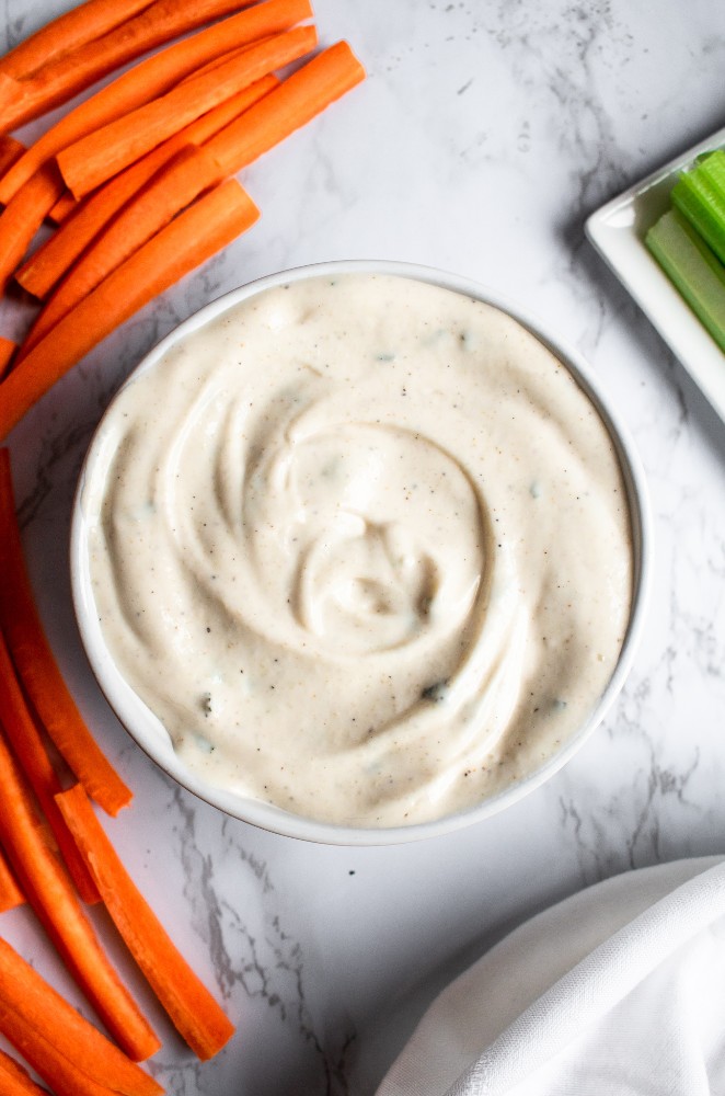 The vegan ranch dip takes 10 minutes, 1 bowl, and 9 staple ingredients. It’s gluten-free, picky-eater-friendly, and makes a terrific quick + easy party appetizer! #vegan #ranch #plantpowercouple #veganappetizer // plantpowercouple.com