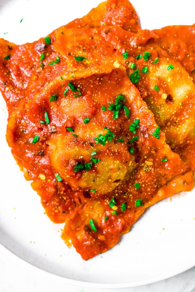 This healthy homemade vegan ravioli recipe is a fun cooking project, and you’ll probably be surprised how easy it actually is! Filled with a spicy Italian-inspired quinoa meat and dairy free spinach ricotta cheese filling, they are FULL of flavor and the perfect plant based comfort food.