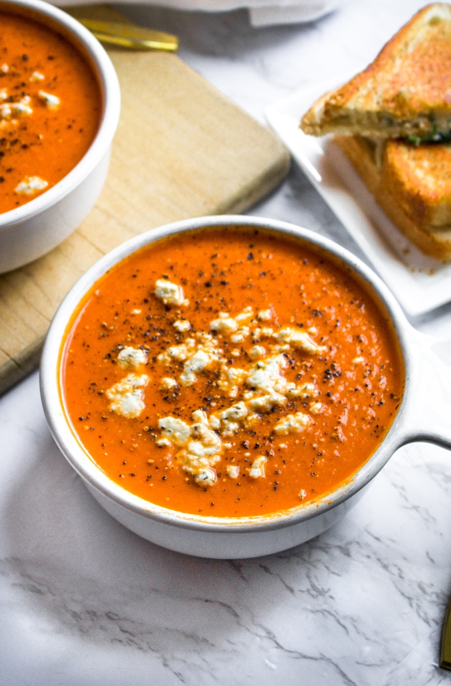 Behold: The creamiest, cheesiest, coziest homemade vegan tomato soup! It's an easy and healthy dinner recipe that can be made from either fresh tomatoes or canned tomatoes. It’s freezer-friendly, perfect for meal prep, and has a rich creamy texture. You'll be shocked it’s dairy-free! #vegan #vegansoup #tomatosoup #dairyfree #plantbased #homemadetomatosoup #pantrystaples #freezerfriendly #easyveganrecipe #freshtomatoes #veganmealprep