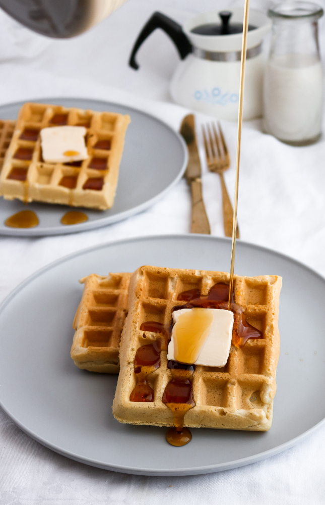 Easy, ten-ingredient, freezer-friendly and toaster-friendly homemade vegan waffles. Simple enough for the beginner cook to dazzle and the perfect addition to a Sunday brunch… or a Thursday dinner! #vegan #waffles #dairyfree #breakfast // plantpowercouple.com