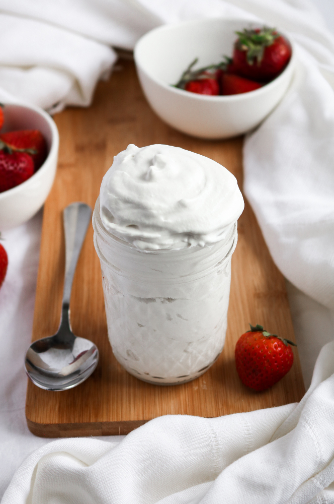 This 5-ingredient vegan whipped cream is easy to make, stable AF, and freezer-friendly. It’s a fantastic addition to sundaes, pancakes, or a big bowl of strawberries - the PERFECT summer treat! #vegan #dairyfree #dessert #recipe // plantpowercouple.com