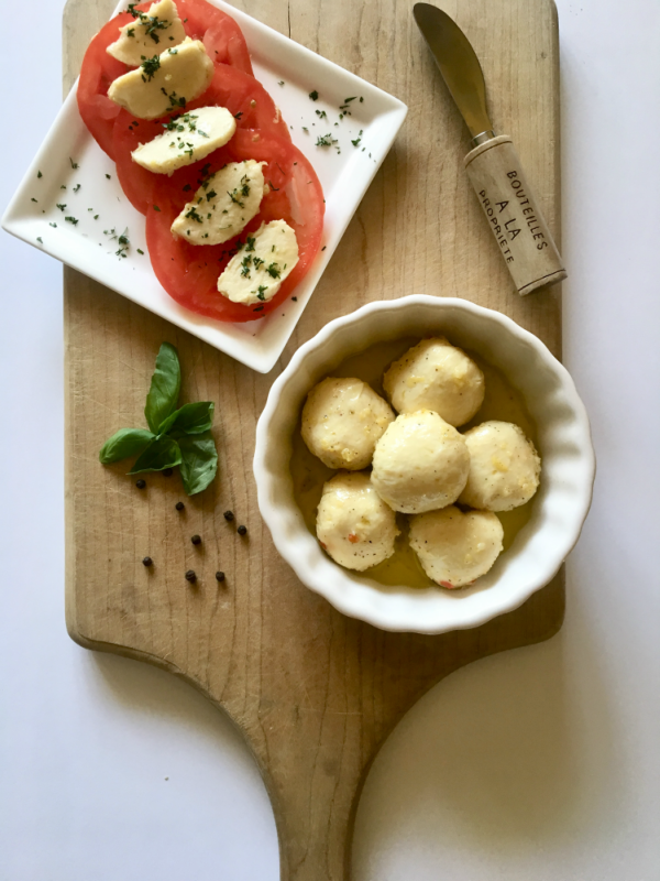 Lemon Pepper Marinated Vegan Bocconcin aka mozzarella balls. This vegan cheese recipe is so darn good! It slices, melts, and tastes great popped right into your mouth! // plantpowercouple.com