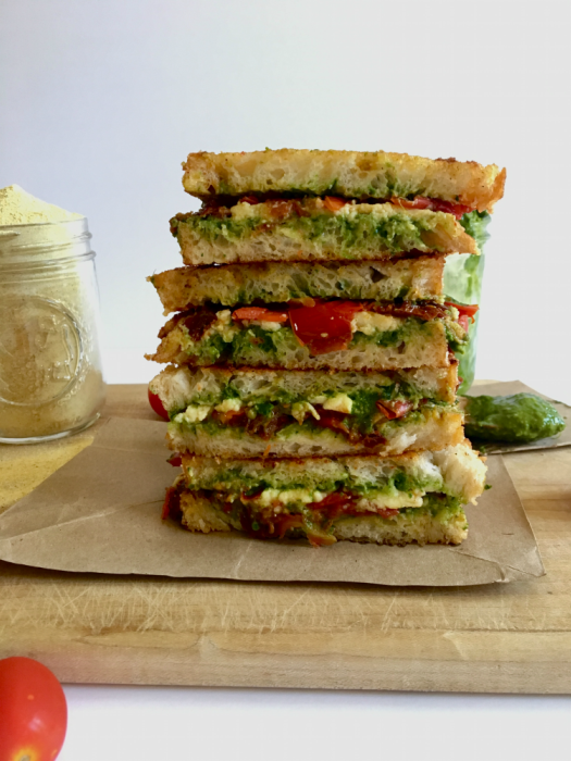 This vegan caprese grilled cheese sandwich is the epitome of summertime greatness! Flavor-packed pesto, balsamic tomato jam, and our favorite fresh vegan mozzarella all wrapped in the loving arms of two pieces of garlic bread - HELLO, HEAVEN! // Recipe: plantpowercouple.com